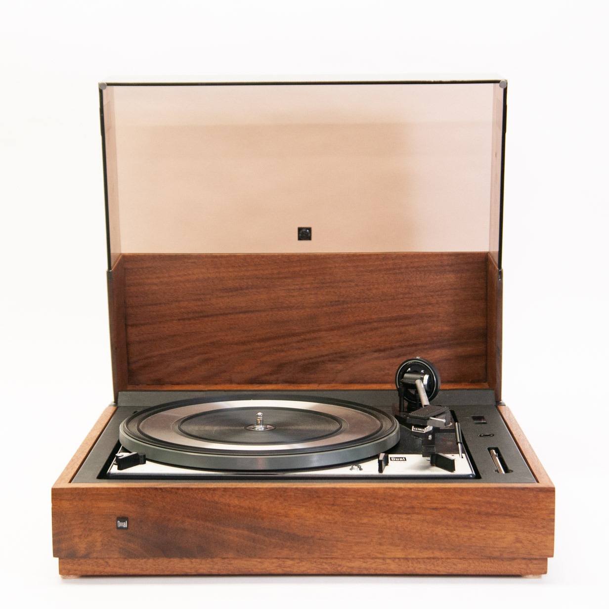 Dual turntable in walnut base, shown with dustcover raised