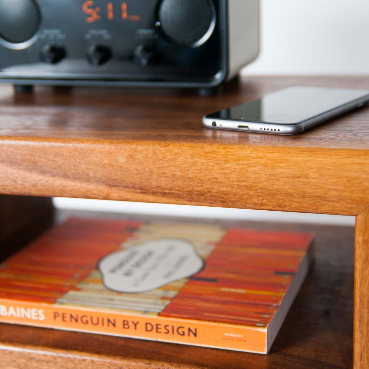 Bedside table, with phone and book