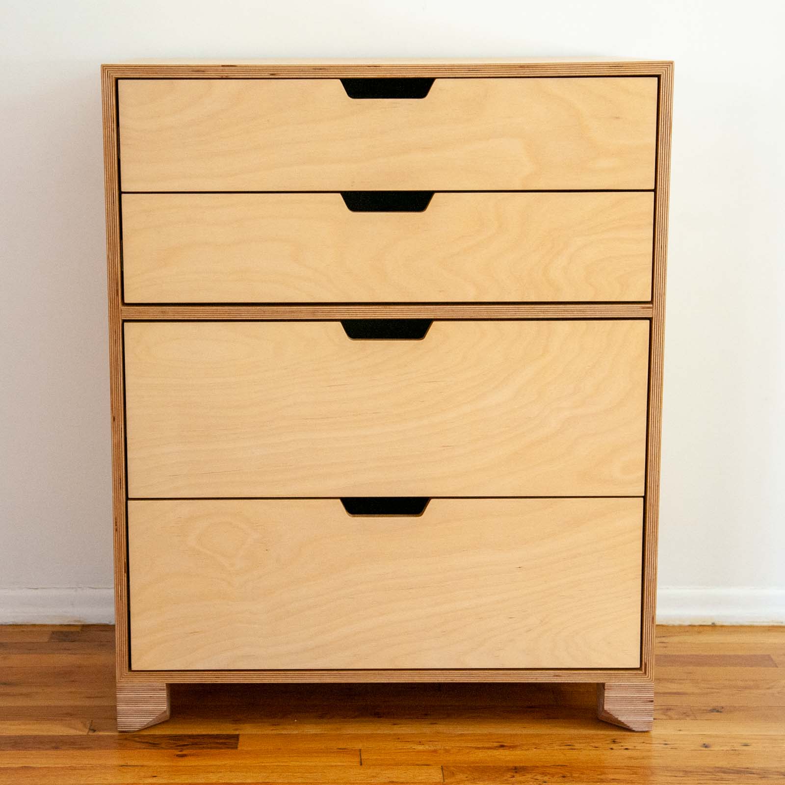 Dresser front view showing light wood-grain pattern on drawer faces