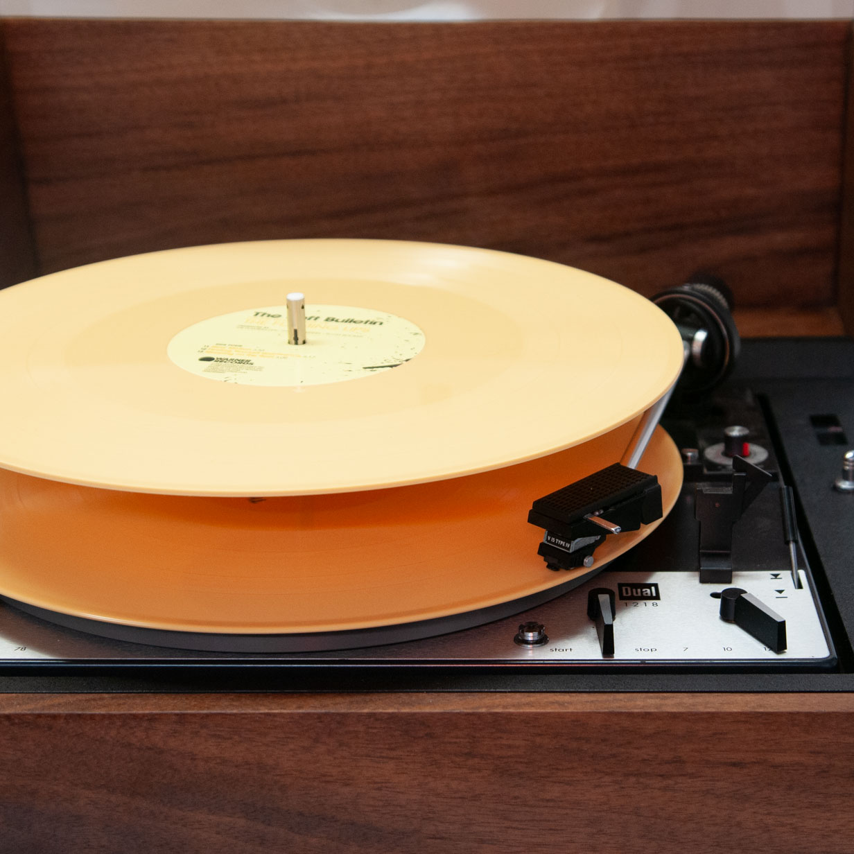 Front view of turntable showing two records stacked in changer mode