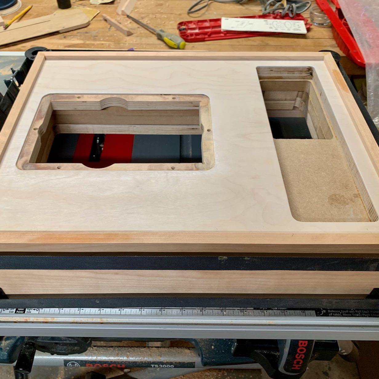 Top view of turtable base in progress, showing recesses for assembly and layered construction