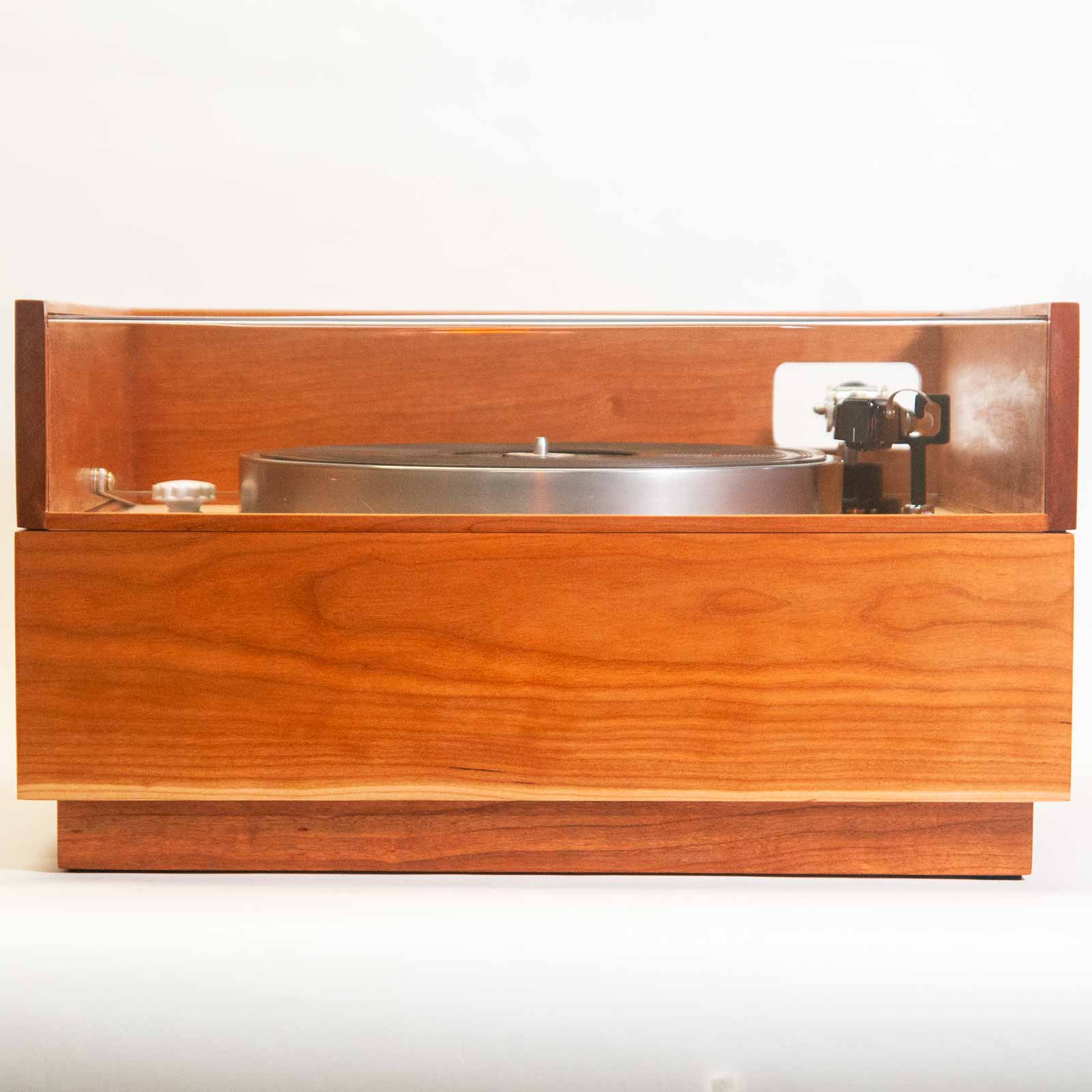 Straight on front view of turntable with dust cover closed