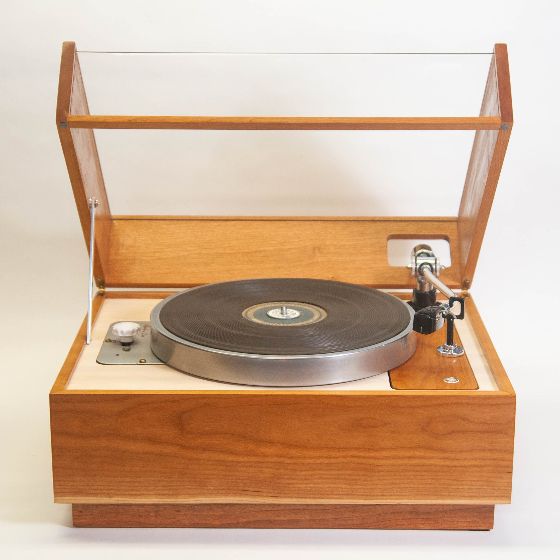 Rek-o-kut L-34 turntable, front view with dust cover raised