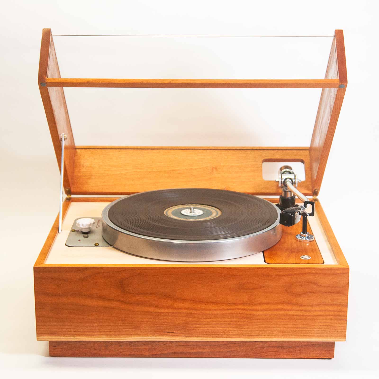 Rek-o-kut L-34 turntable, front view with dust cover raised